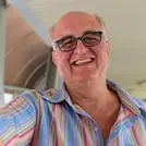A happy man holding RegenVive, exuding confidence and satisfaction with the product's remarkable results.